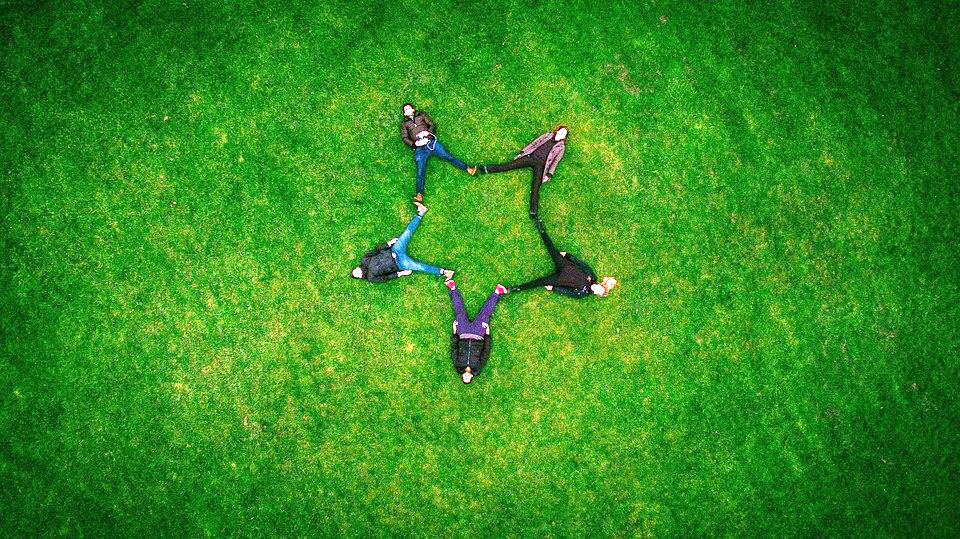 Happy friends on the grass